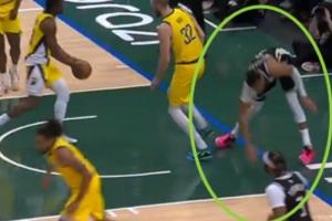 崴脚+膝盖过度伸展！字母哥扣篮落地失衡 捂着左膝！ 配图